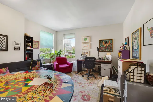 a bedroom with furniture and a window
