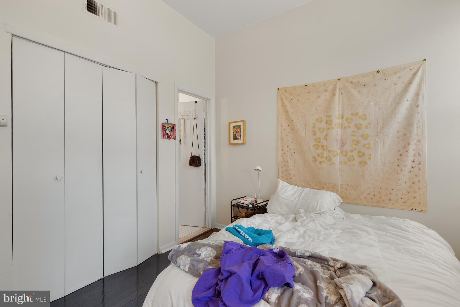 2137 Spruce Street, Unit 8 Philadelphia, PA 19103 - Photo 7 of 12 a bedroom with a bed and a closet