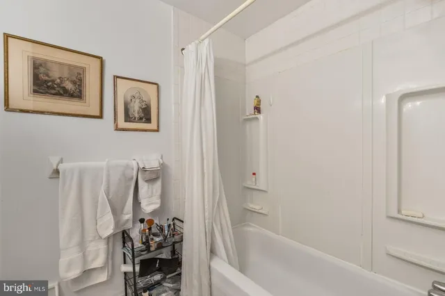 a bathroom with a shower and a tub