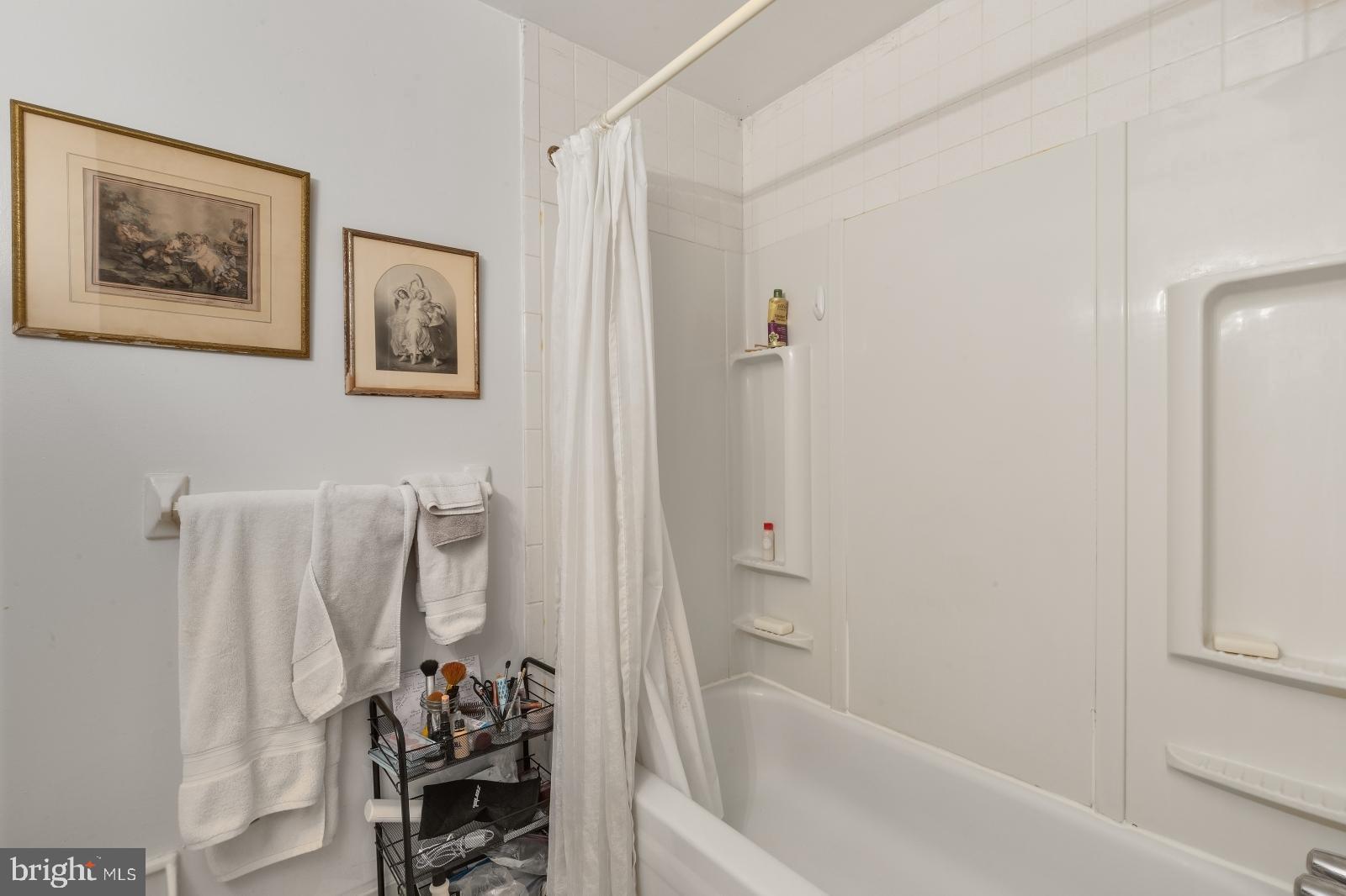 2137 Spruce Street, Unit 8 Philadelphia, PA 19103 - Photo 9 of 12 a bathroom with a shower and a tub