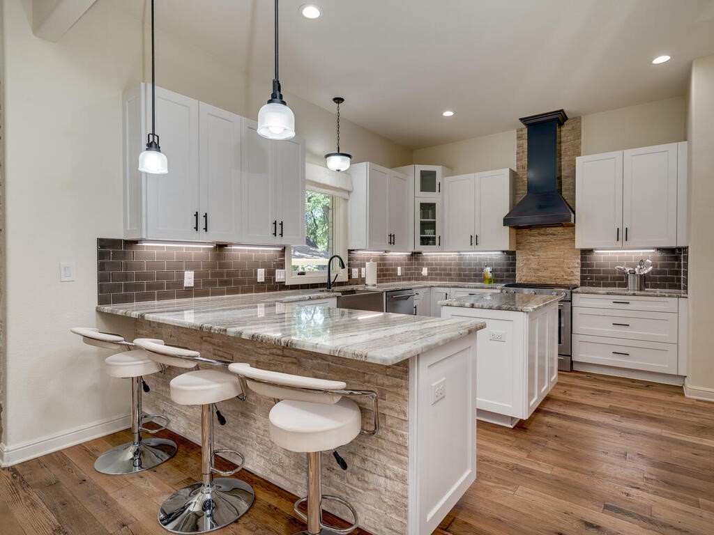 3907 Bailey Lane Austin, TX 78756 - Photo 12 of 37 The generous kitchen will appeal to the chef in the household with gourmet finishes and fixtures, a free flowing layout, and commercial style stainless appliances