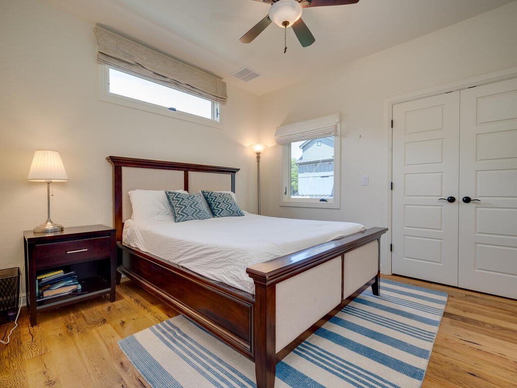 3907 Bailey Lane Austin, TX 78756 - Photo 29 of 37 This beautiful bedrooms feature hand scraped wood flooring, high ceilings with ceiling fans, and ample sized closets