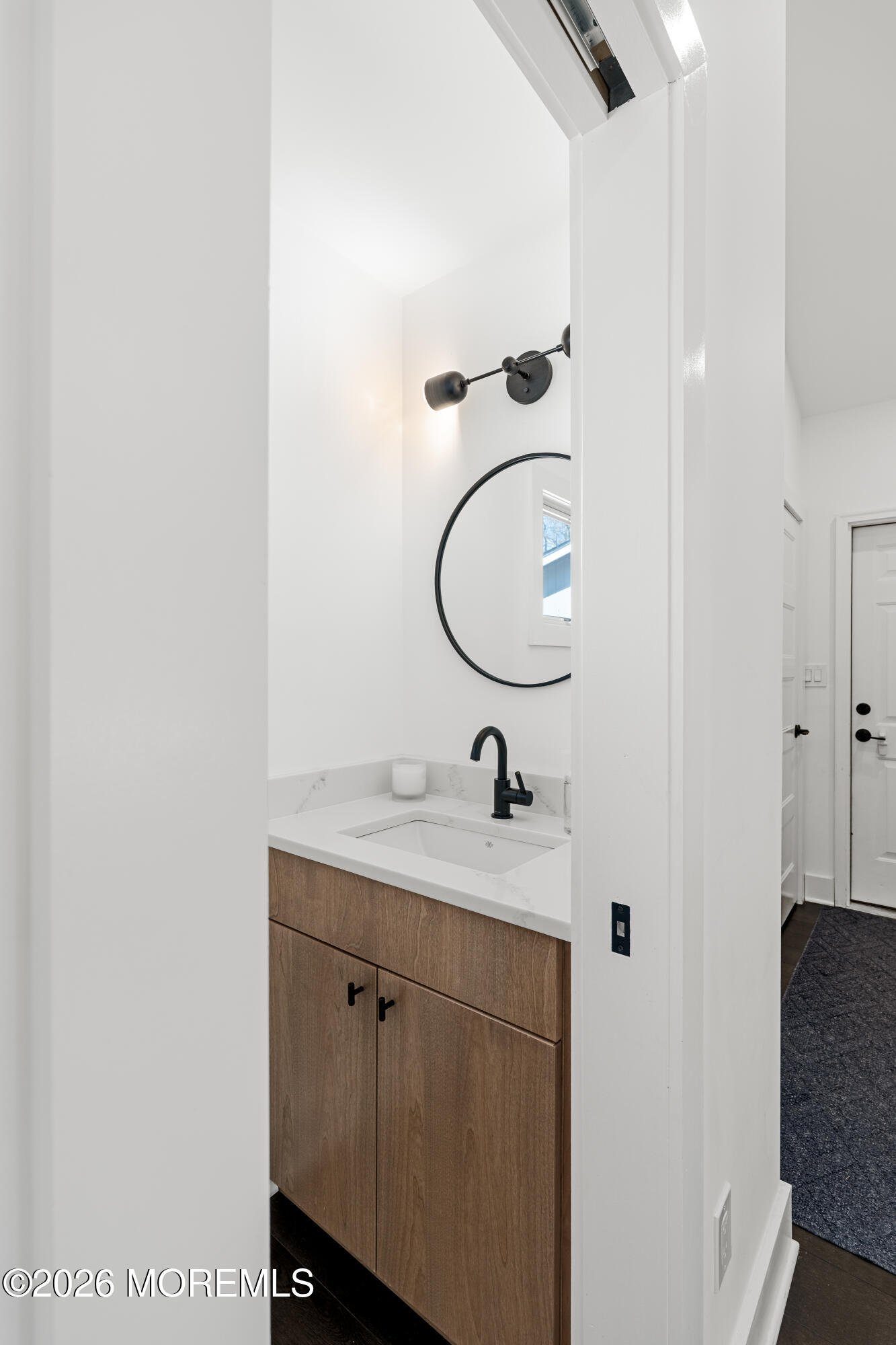 710 Fernmere Avenue Interlaken, NJ 07712 - Photo 16 of 37 a bathroom with a granite countertop sink a mirror and shower
