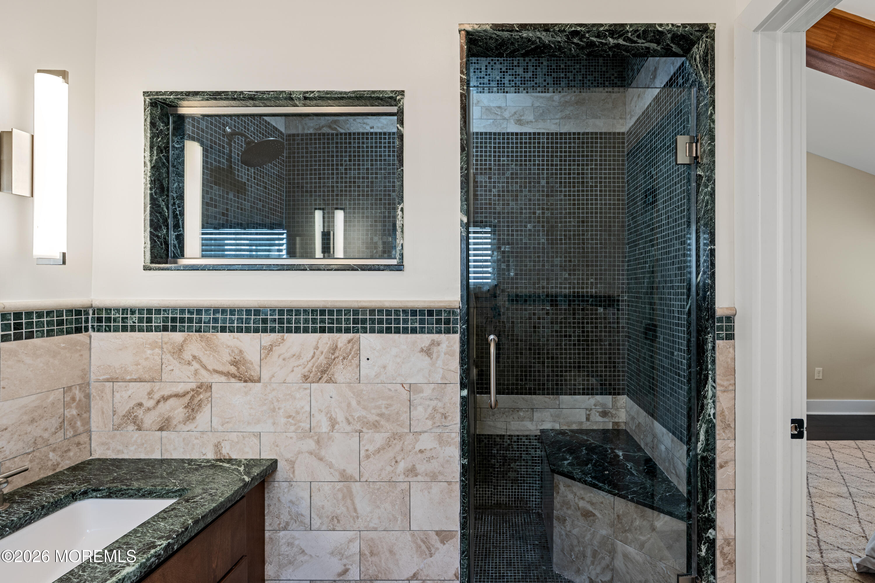 710 Fernmere Avenue Interlaken, NJ 07712 - Photo 22 of 37 a bathroom with a granite countertop sink a mirror and shower