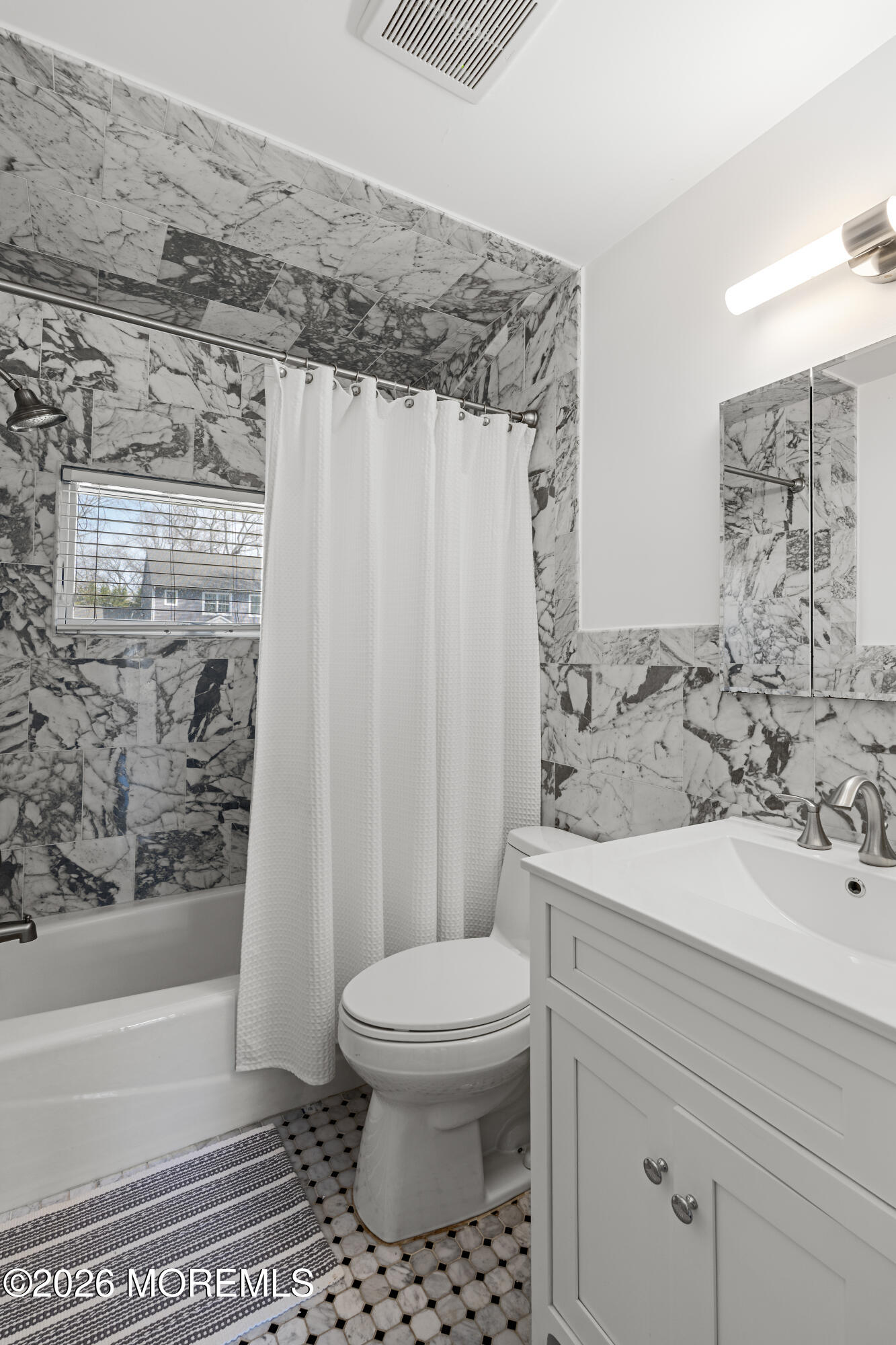 710 Fernmere Avenue Interlaken, NJ 07712 - Photo 28 of 37 a bathroom with a sink a toilet and shower