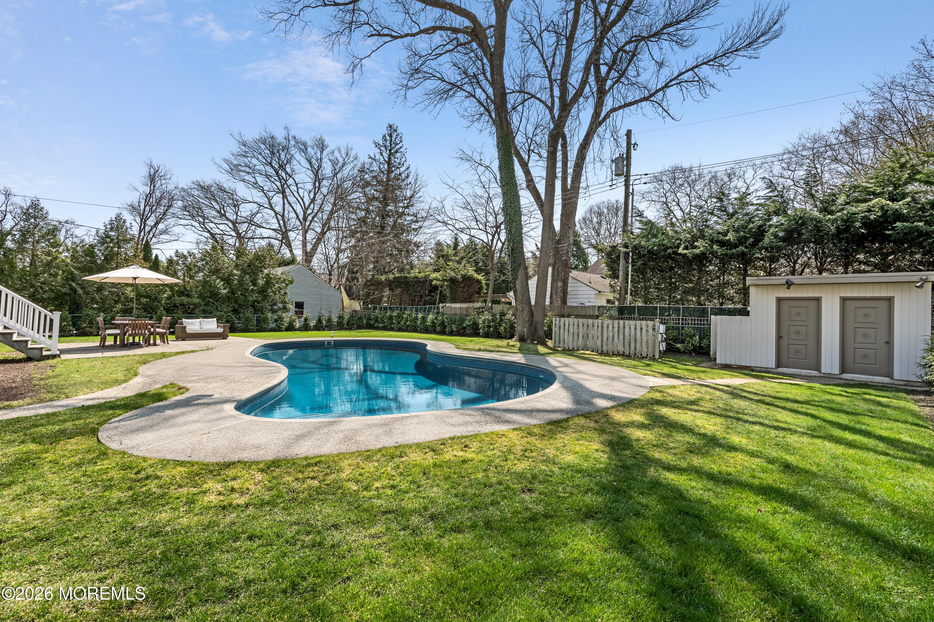 710 Fernmere Avenue Interlaken, NJ 07712 - Photo 34 of 37 a view of a swimming pool with a yard