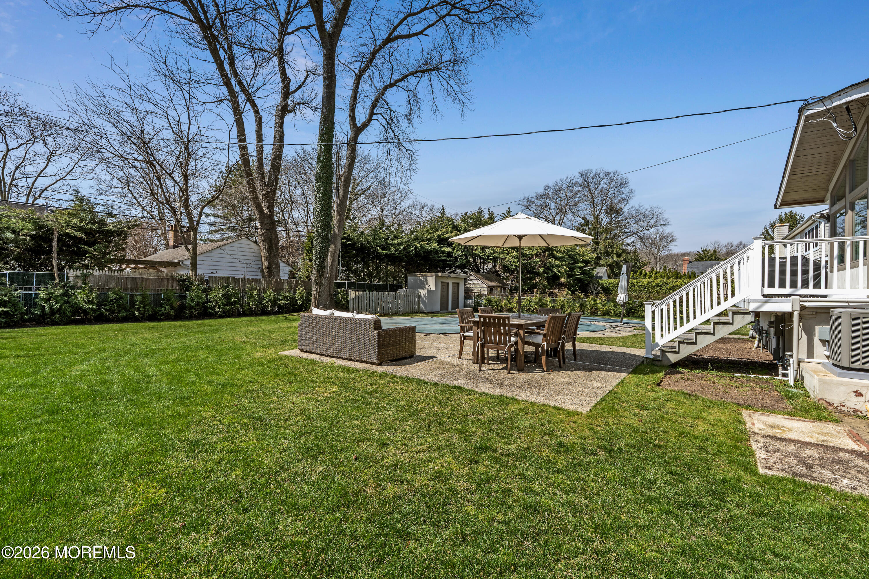 710 Fernmere Avenue Interlaken, NJ 07712 - Photo 35 of 37 a view of a house with backyard and sitting area