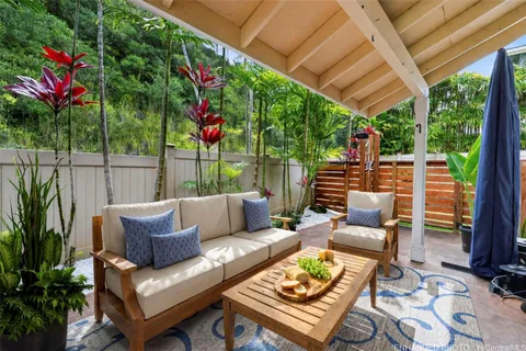 a outdoor living space with furniture and garden view