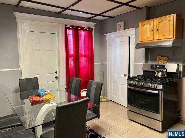 304 Harrison Avenue, Unit 1) Harrison, NJ 07029 - Photo 4 of 10 a kitchen with stainless steel appliances granite countertop a stove and a refrigerator