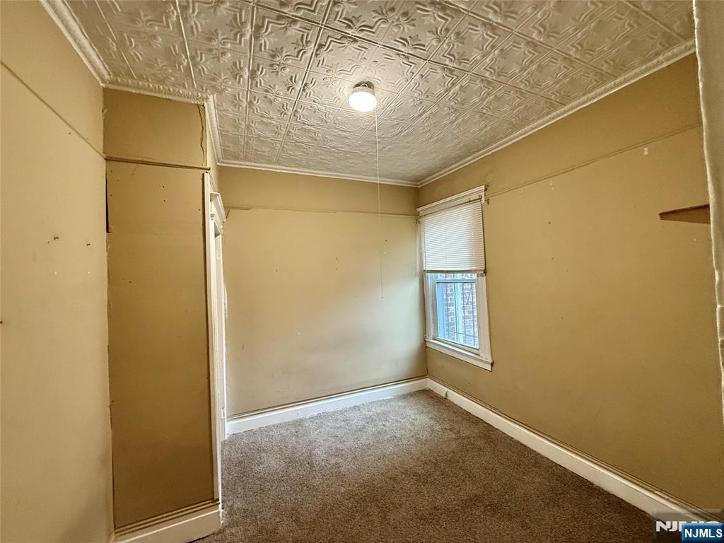 304 Harrison Avenue, Unit 1) Harrison, NJ 07029 - Photo 5 of 15 a view of an empty room with windows and closet