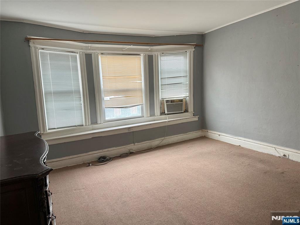 304 Harrison Avenue, Unit 1) Harrison, NJ 07029 - Photo 7 of 15 an empty room with a window