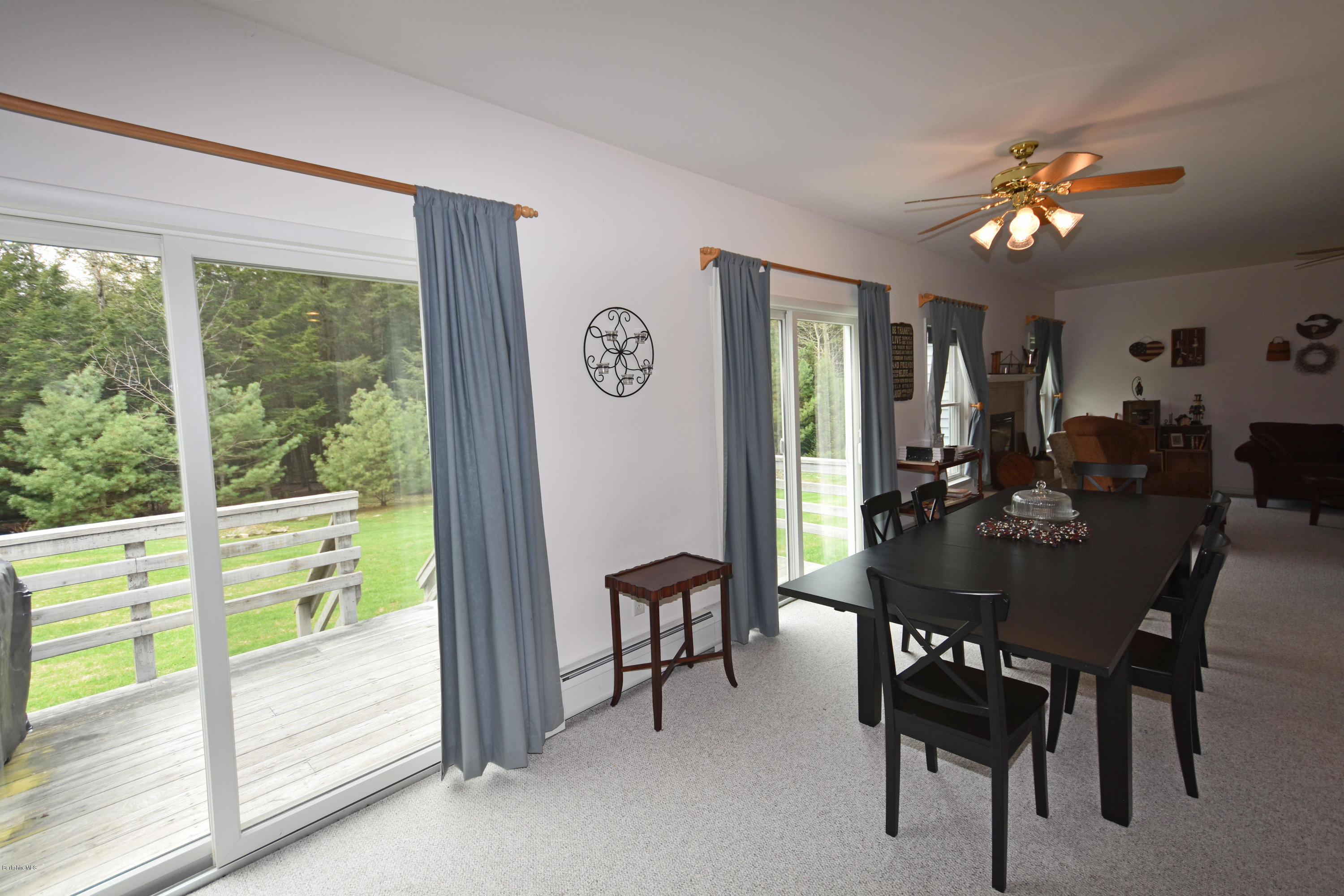 555 West Center Road Otis, MA 01253 - Photo 14 of 49 a view of a dining room with furniture window and outside view