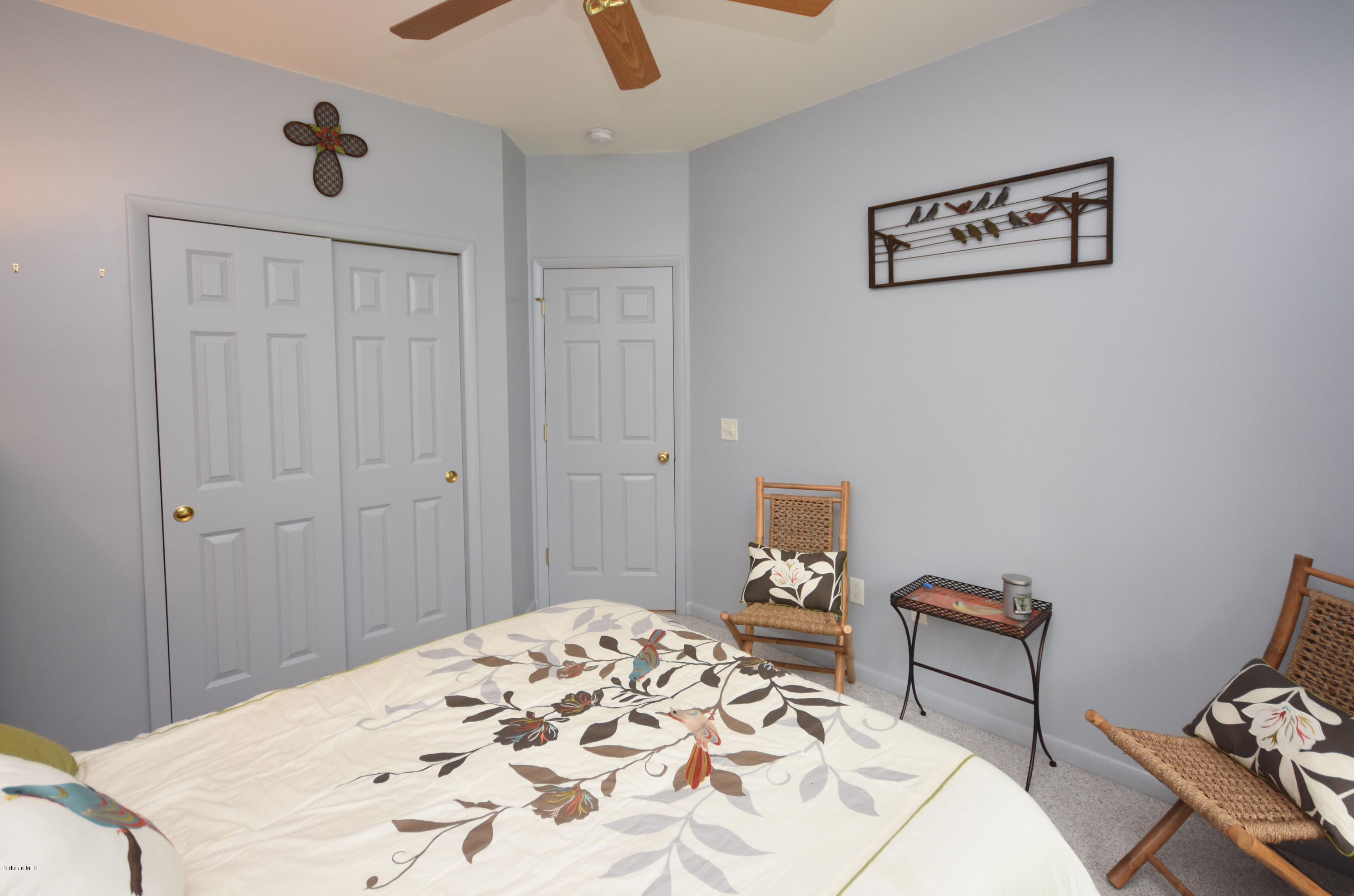 555 West Center Road Otis, MA 01253 - Photo 31 of 49 a bedroom with a bed and a table in it