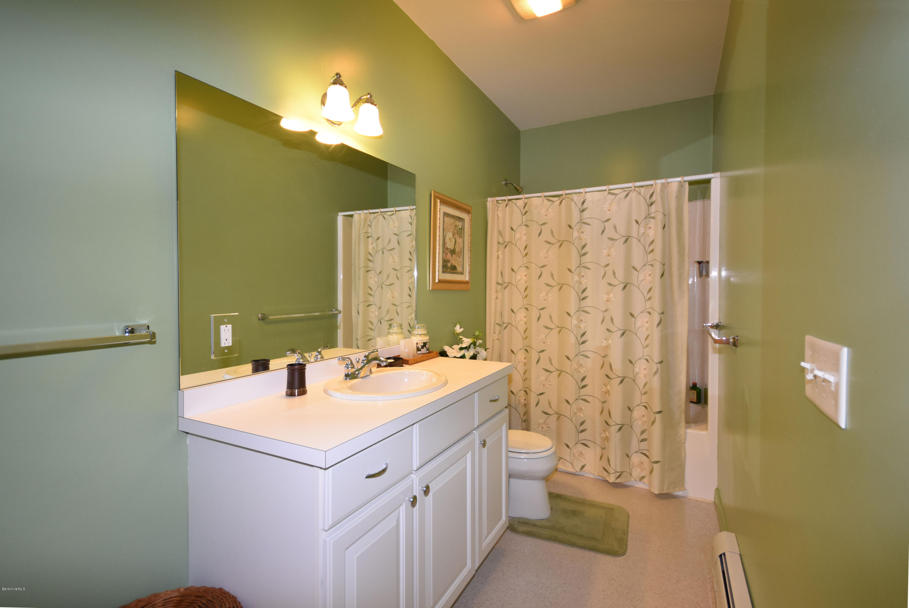 555 West Center Road Otis, MA 01253 - Photo 36 of 49 a bathroom with a double vanity sink mirror and toilet