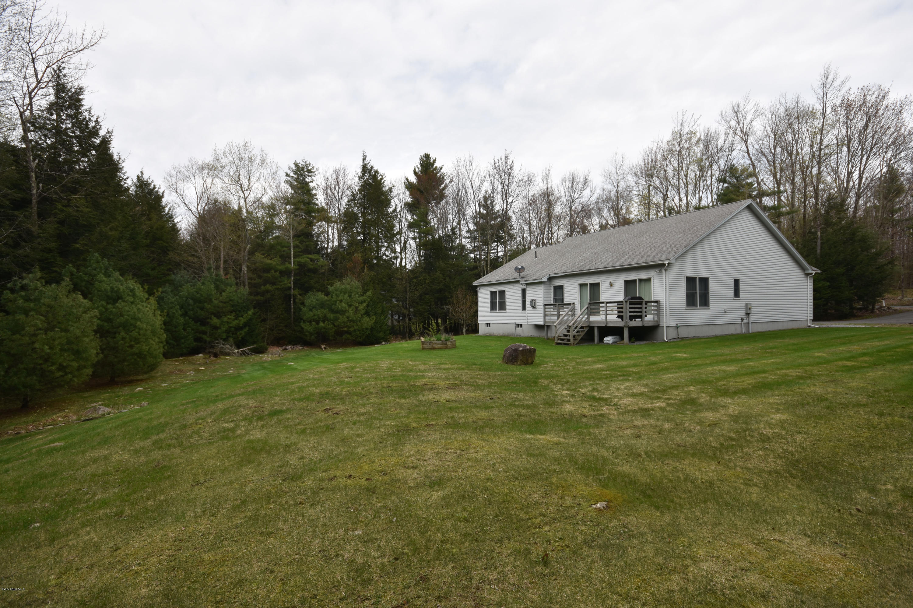 555 West Center Road Otis, MA 01253 - Photo 46 of 49 a view of a house with backyard