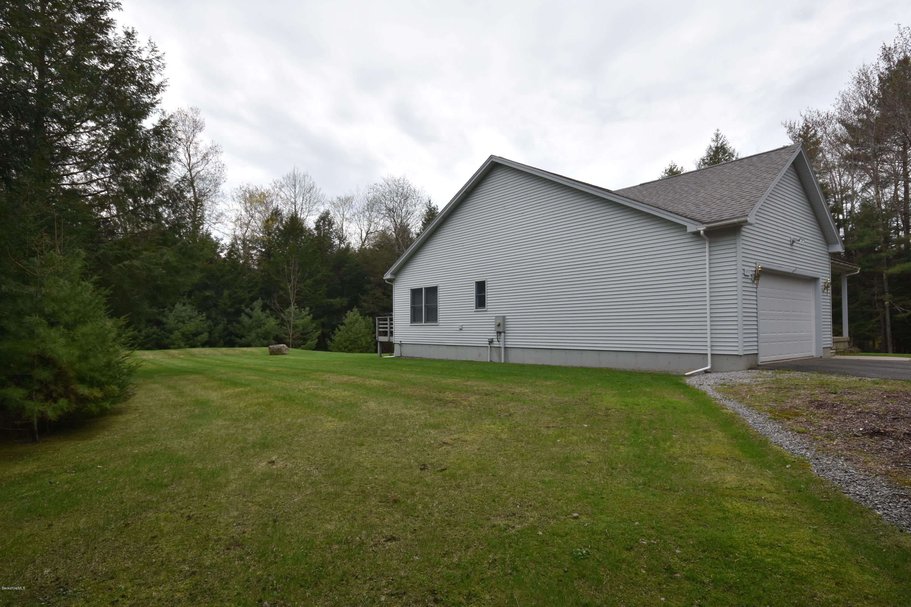 555 West Center Road Otis, MA 01253 - Photo 47 of 49 a view of a backyard with a garden