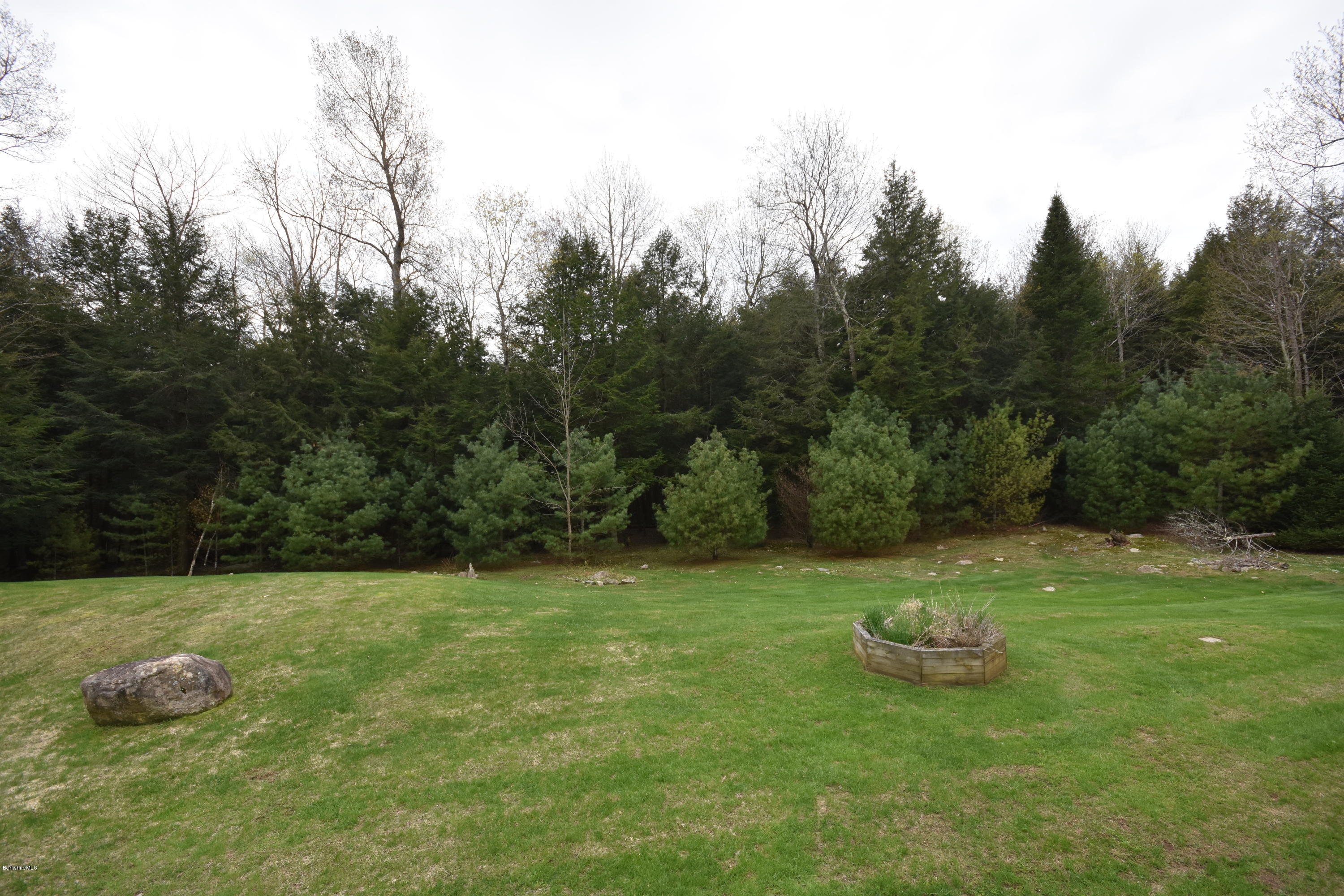 555 West Center Road Otis, MA 01253 - Photo 49 of 49 a backyard of a house with table and chairs