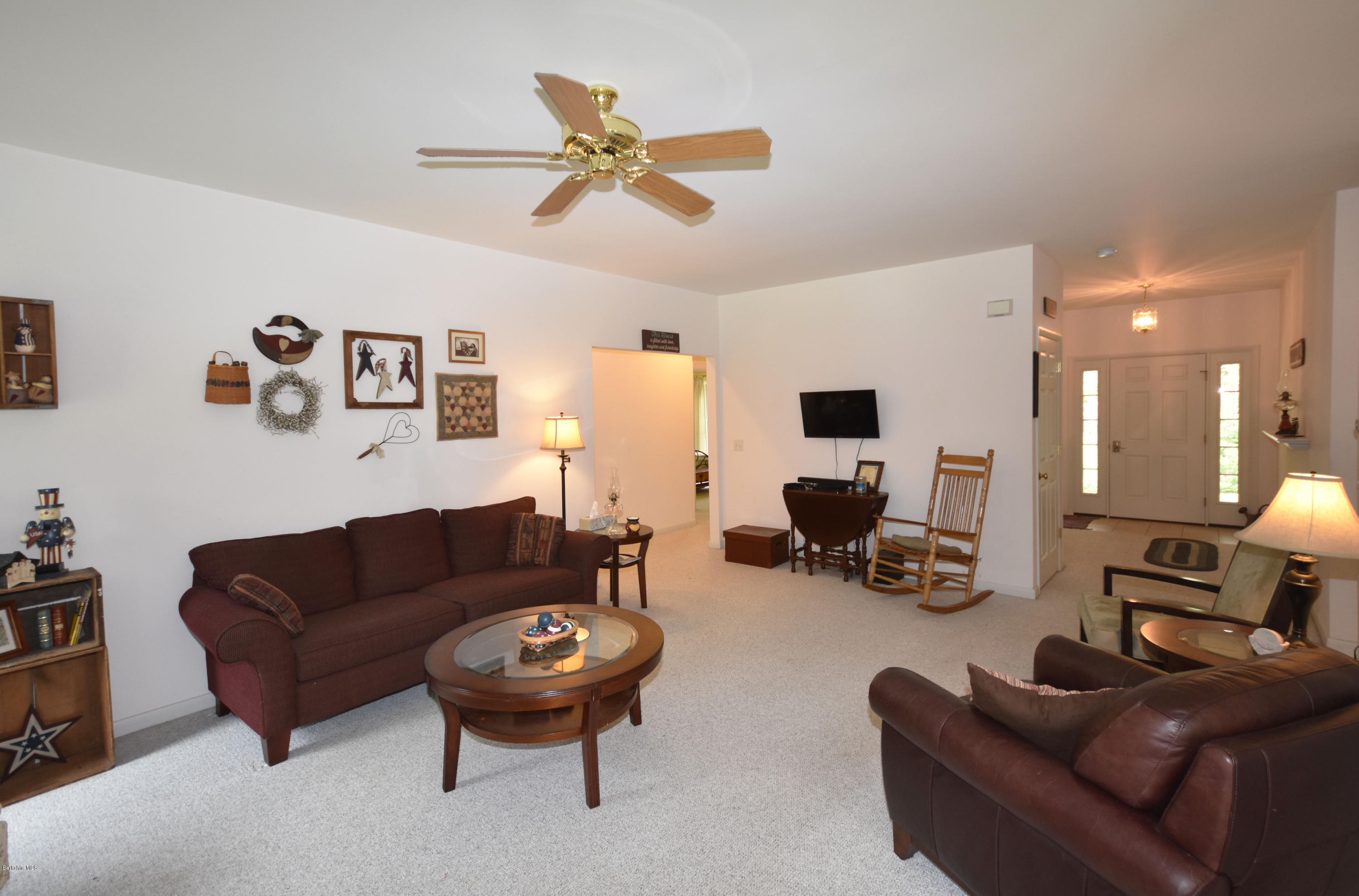 555 West Center Road Otis, MA 01253 - Photo 6 of 49 a living room with furniture and a flat screen tv