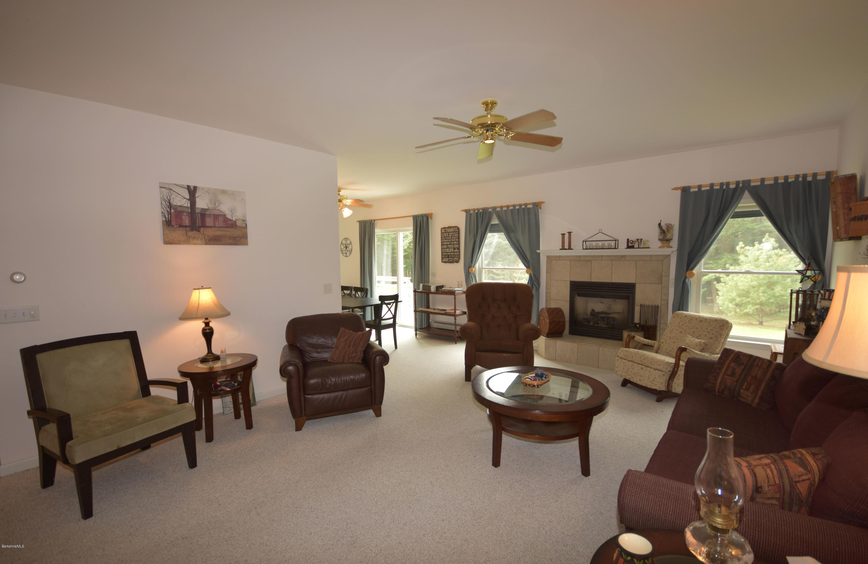 555 West Center Road Otis, MA 01253 - Photo 7 of 49 a living room with furniture a fireplace and a table