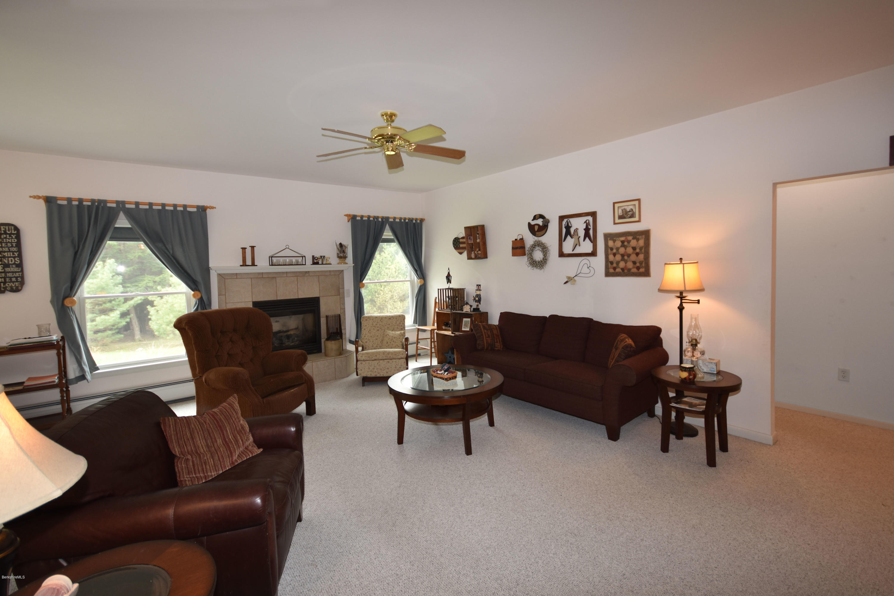 555 West Center Road Otis, MA 01253 - Photo 8 of 49 a living room with furniture and a large window