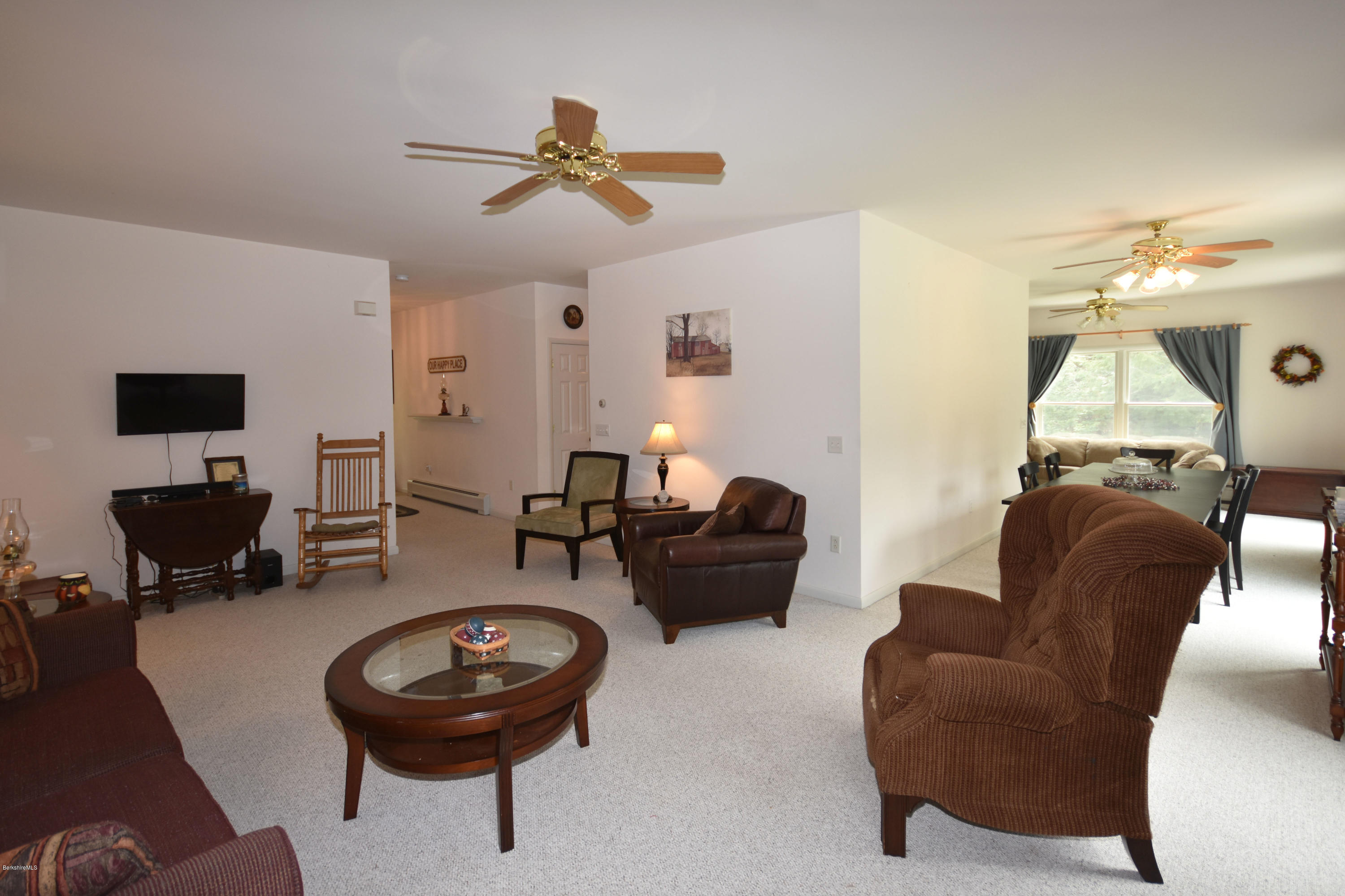 555 West Center Road Otis, MA 01253 - Photo 9 of 49 a living room with furniture and a flat screen tv