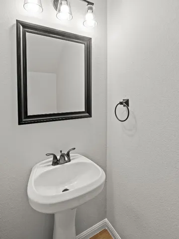 a view of a kitchen with wooden floor and stairs
