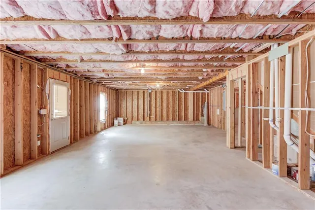 a view of a room with wooden walls