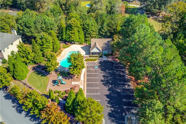 an aerial view of a house with a yard and garden