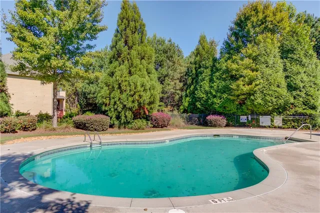 a view of a swimming pool with a patio