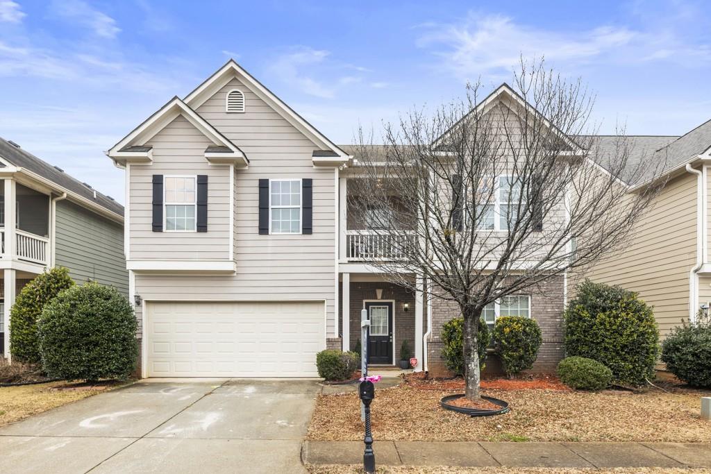 5791 Apple Grove Road Northeast Buford, GA 30519 - Photo 1 of 1 a front view of a house with a yard and garage