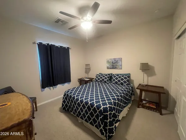 a bedroom with bed and a window