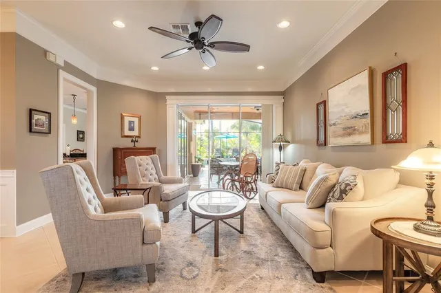 a dining room with furniture and chandelier