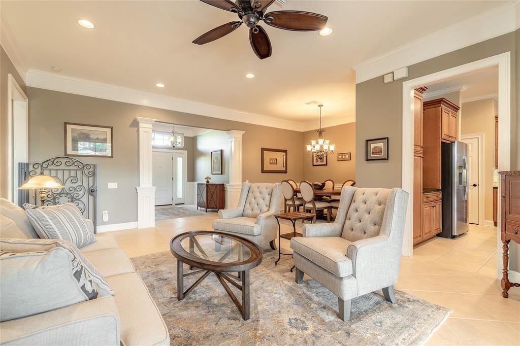 10915 Ledgement Lane Windermere, FL 34786 - Photo 12 of 60 a living room with furniture and a large window