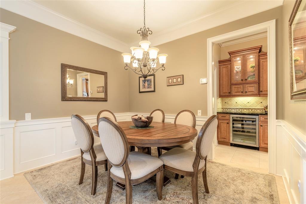 10915 Ledgement Lane Windermere, FL 34786 - Photo 13 of 60 a dining room with furniture and chandelier