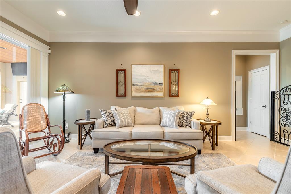 10915 Ledgement Lane Windermere, FL 34786 - Photo 15 of 60 a living room with furniture and a lamp