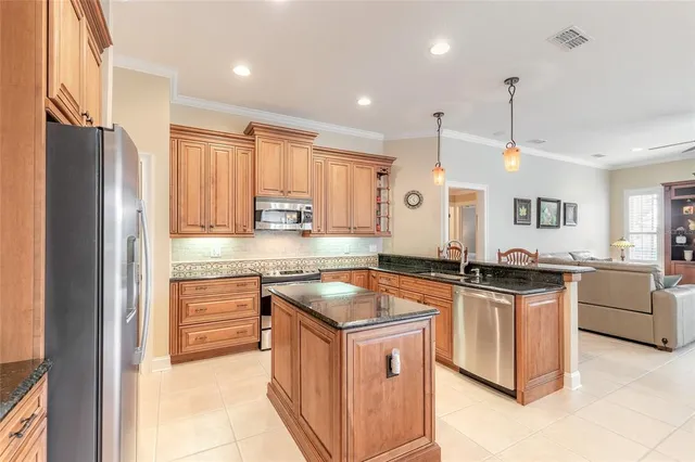 a dining room with furniture a chandelier and wooden floor