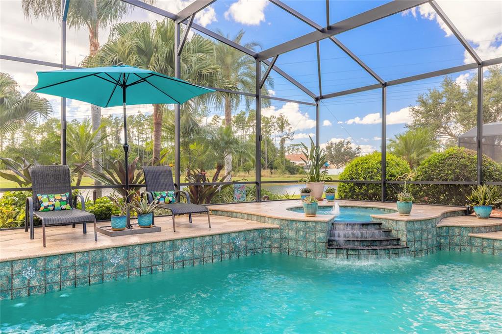 10915 Ledgement Lane Windermere, FL 34786 - Photo 2 of 60 a view of a swimming pool with a patio