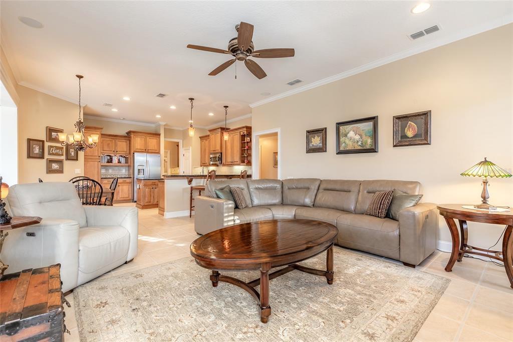 10915 Ledgement Lane Windermere, FL 34786 - Photo 23 of 60 a living room with furniture kitchen view and a chandelier