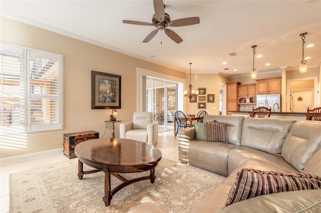 10915 Ledgement Lane Windermere, FL 34786 - Photo 24 of 60 a living room with furniture kitchen view and a large window