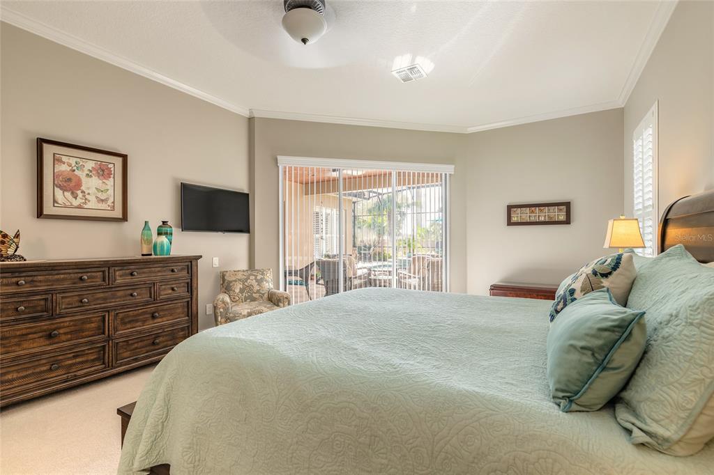 10915 Ledgement Lane Windermere, FL 34786 - Photo 25 of 60 a bedroom with a bed and a flat screen tv