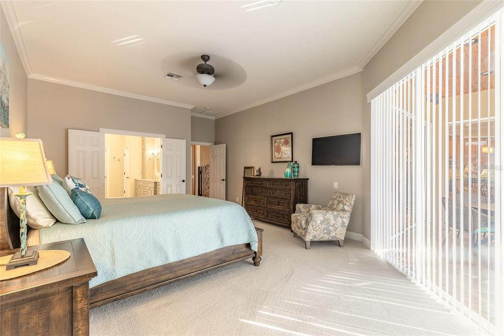 10915 Ledgement Lane Windermere, FL 34786 - Photo 26 of 60 a spacious bedroom with a bed and window