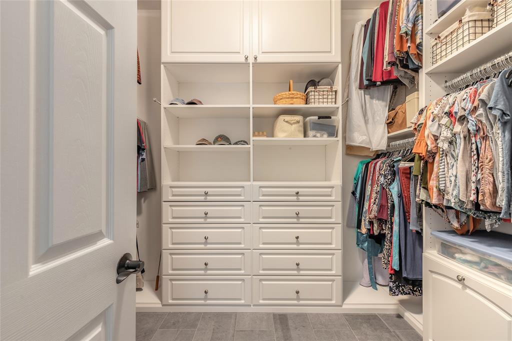 10915 Ledgement Lane Windermere, FL 34786 - Photo 29 of 60 a view of walk in closet with clothes and shoes