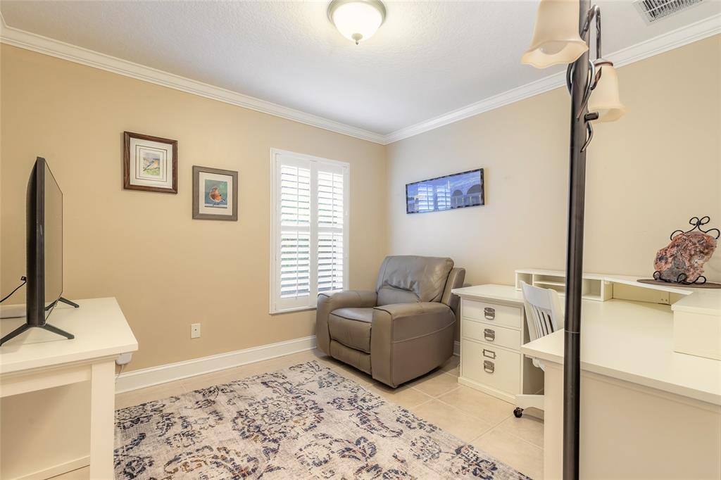 10915 Ledgement Lane Windermere, FL 34786 - Photo 34 of 60 a living room with furniture and a flat screen tv