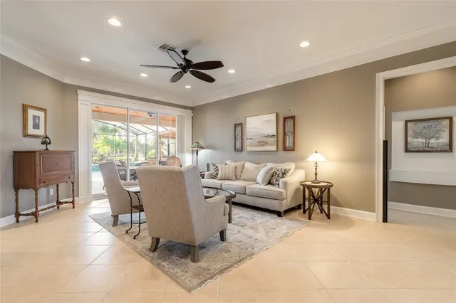 a spacious bedroom with a bed a couch and large window