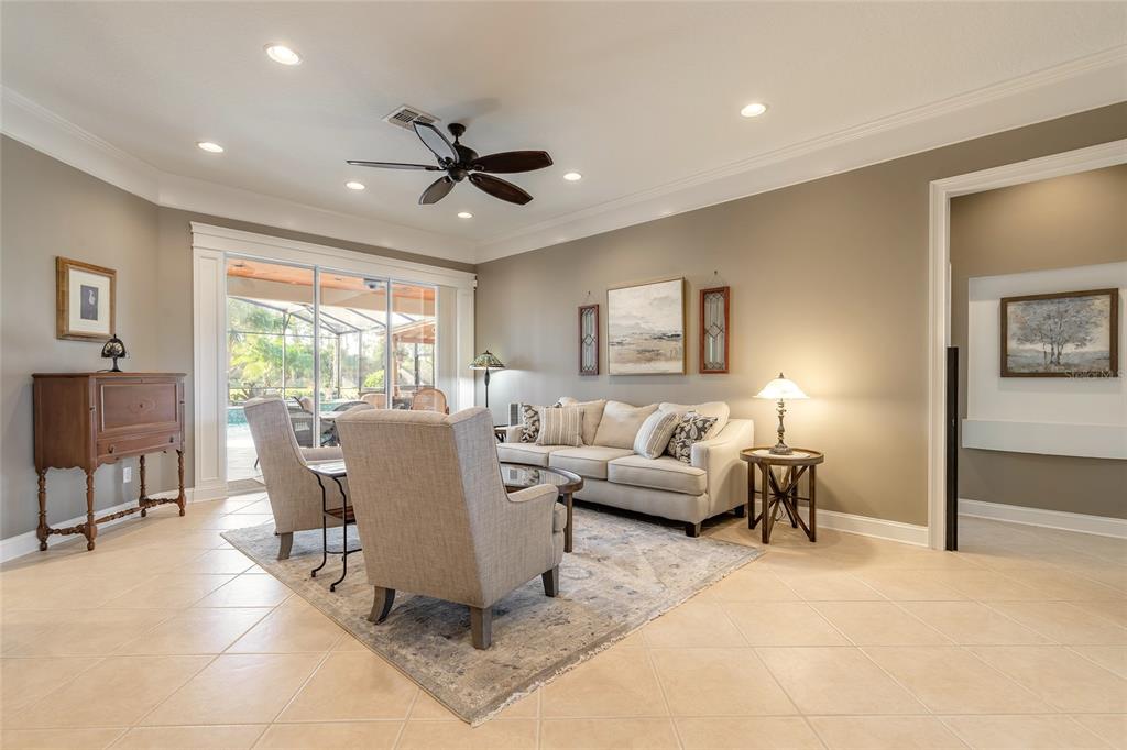10915 Ledgement Lane Windermere, FL 34786 - Photo 4 of 60 a living room with furniture and a large window