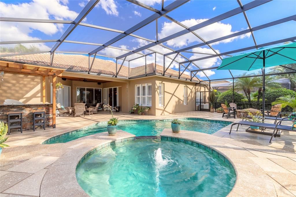 10915 Ledgement Lane Windermere, FL 34786 - Photo 44 of 60 a view of a swimming pool with a patio