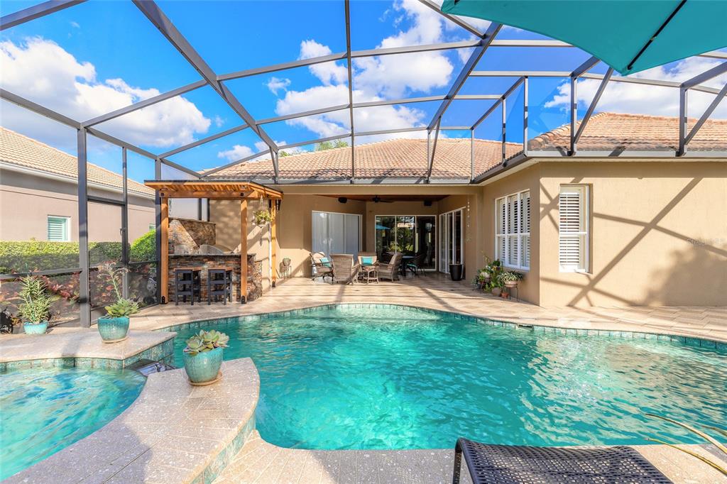 10915 Ledgement Lane Windermere, FL 34786 - Photo 45 of 60 a view of a backyard with sitting area