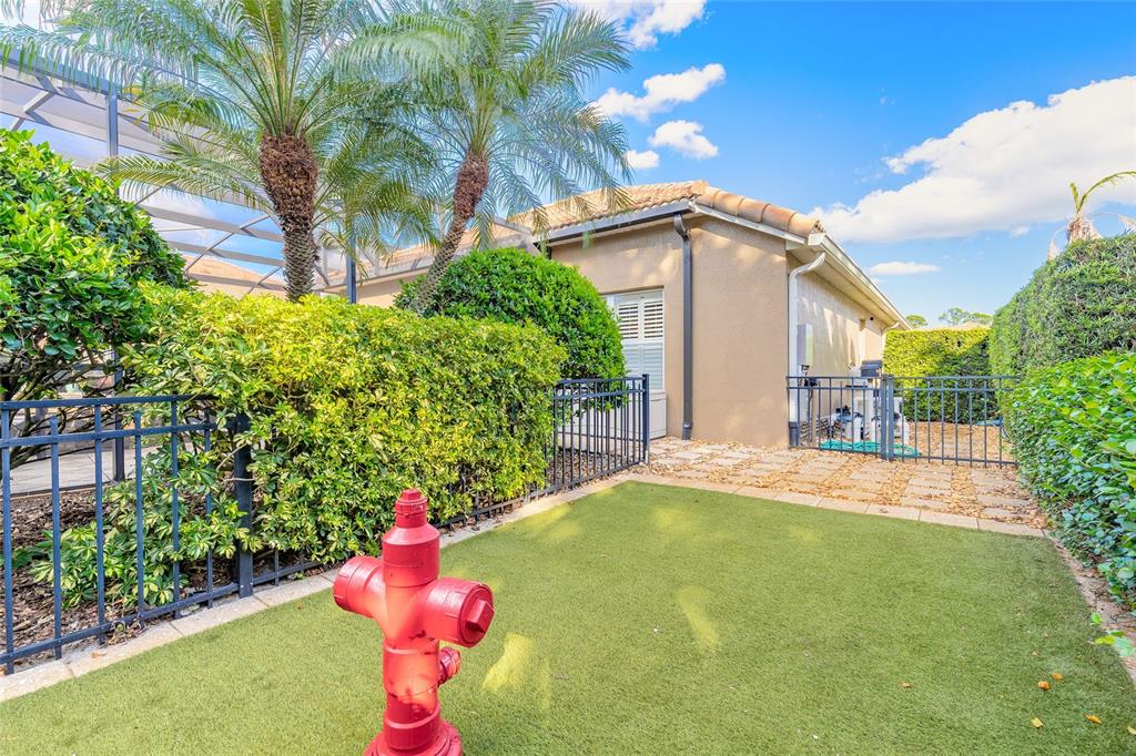 10915 Ledgement Lane Windermere, FL 34786 - Photo 52 of 60 a front view of a house with a yard and garage