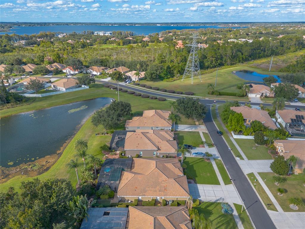 10915 Ledgement Lane Windermere, FL 34786 - Photo 58 of 60 an aerial view of a house with a garden and lake view