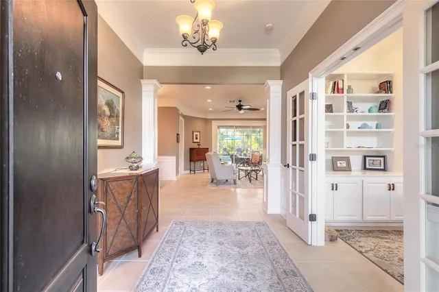 a reading room with furniture rug and a window